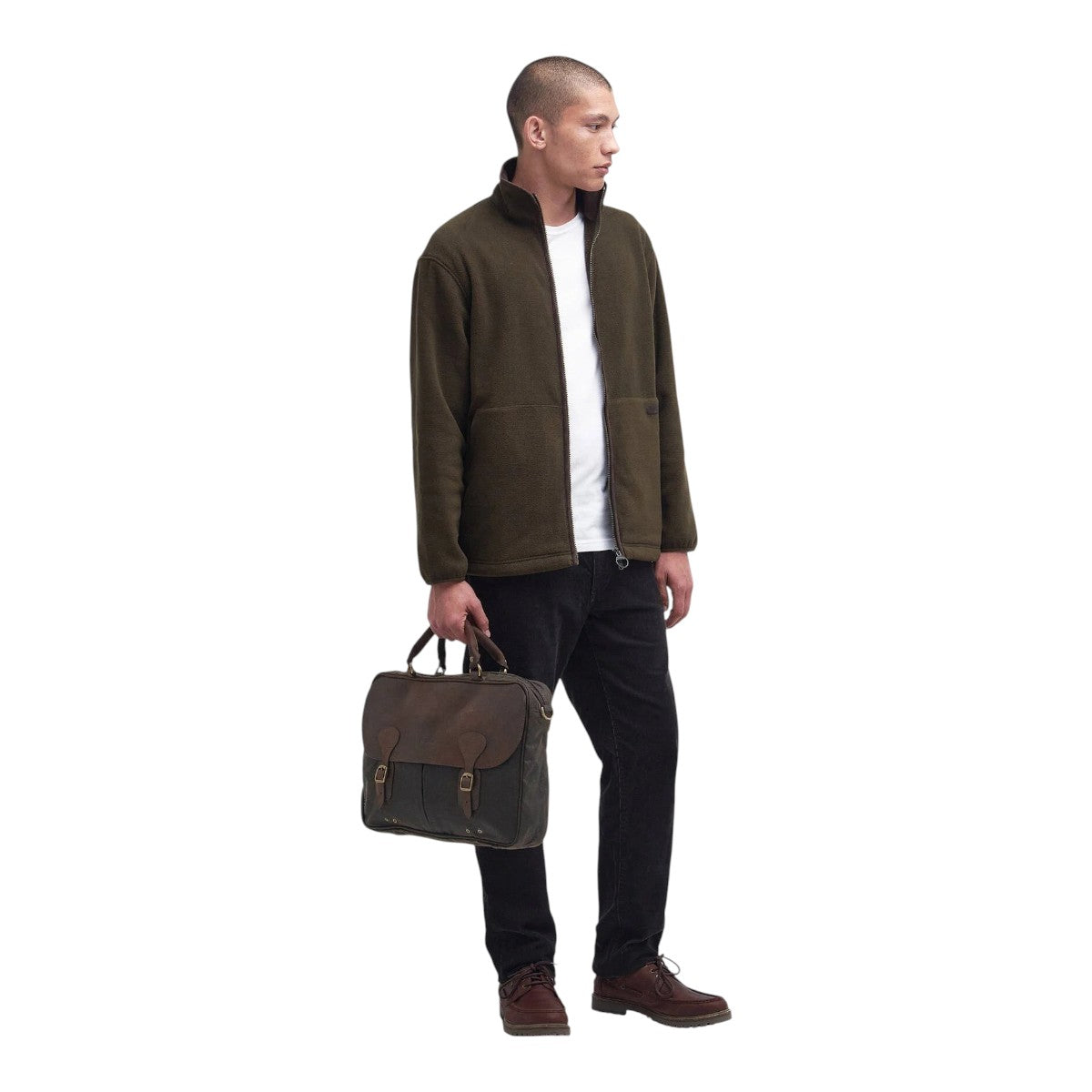 MILWORKS olive waxed leather briefcase with antique brass hardware and tartan lining held by a man in a fleece jacket.