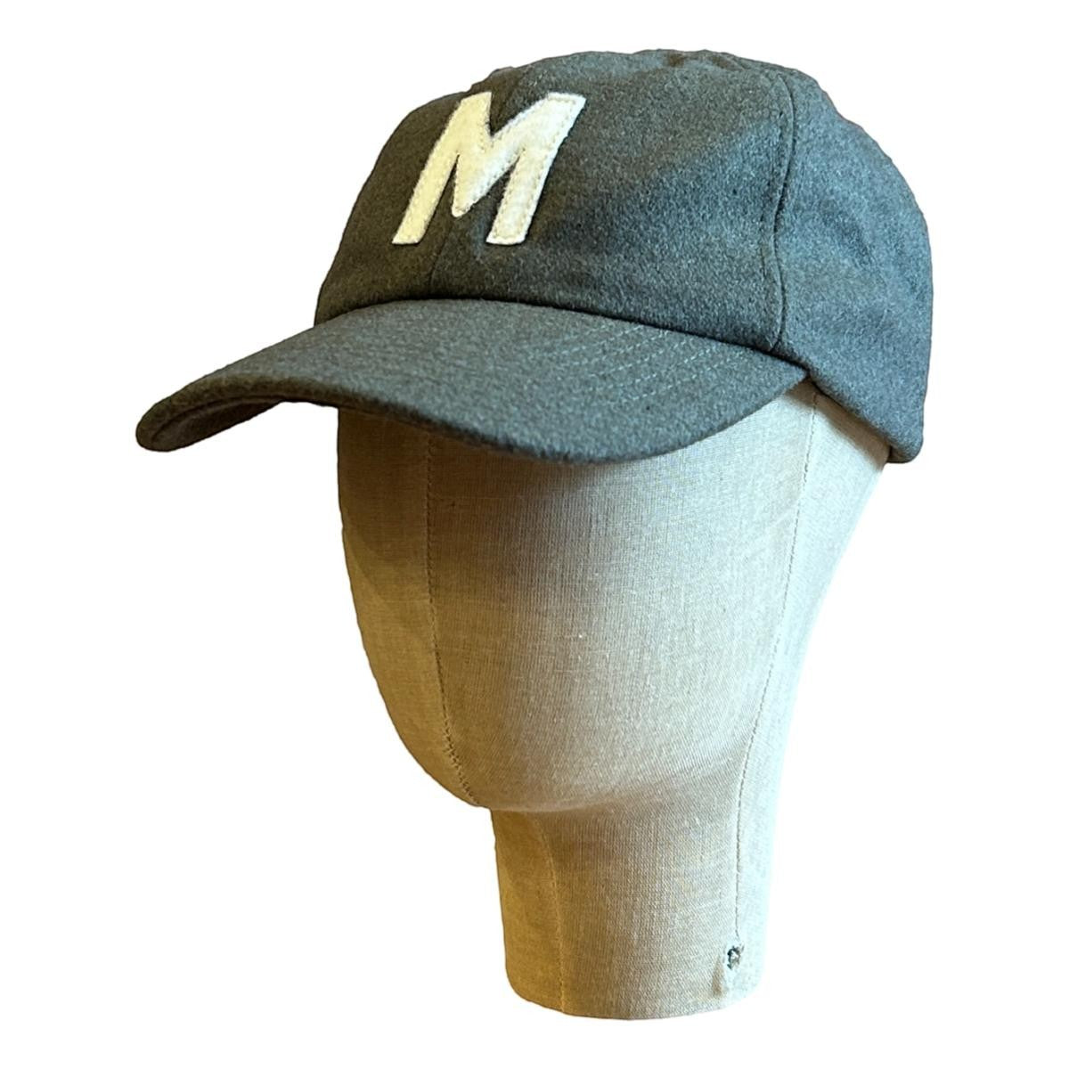 MILWORKS olive green wool blend baseball cap with a white felt "M" applique and flat peak.
