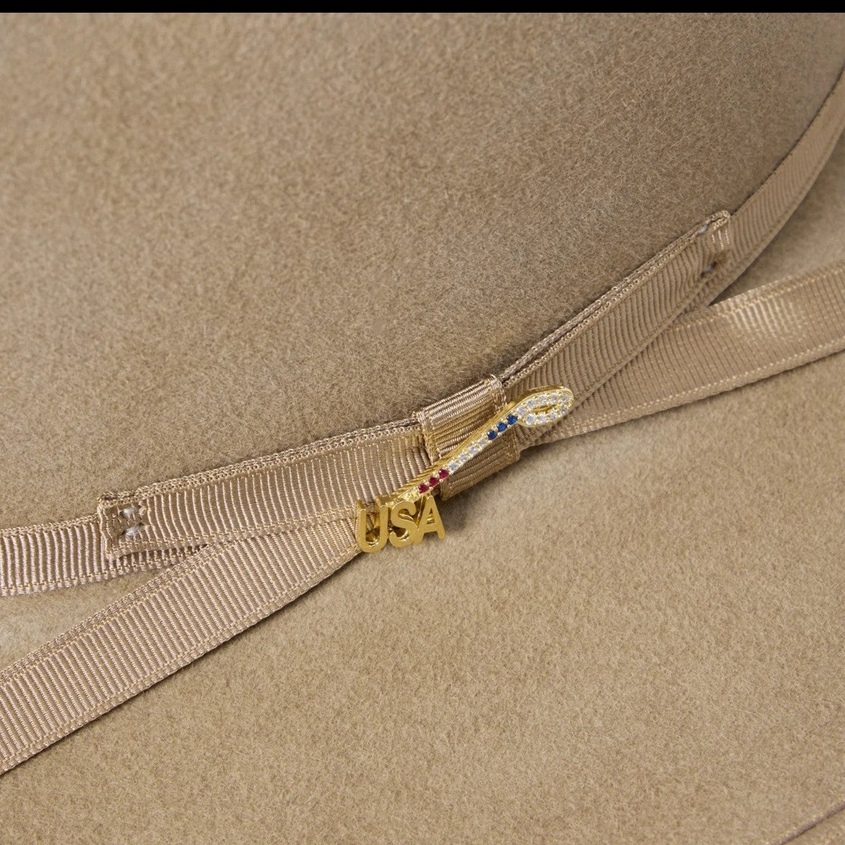 MILWORKS Open Road 6X fur felt hat in fawn with a grosgrain band and gold-tone USA branding iron pin with inset stones.