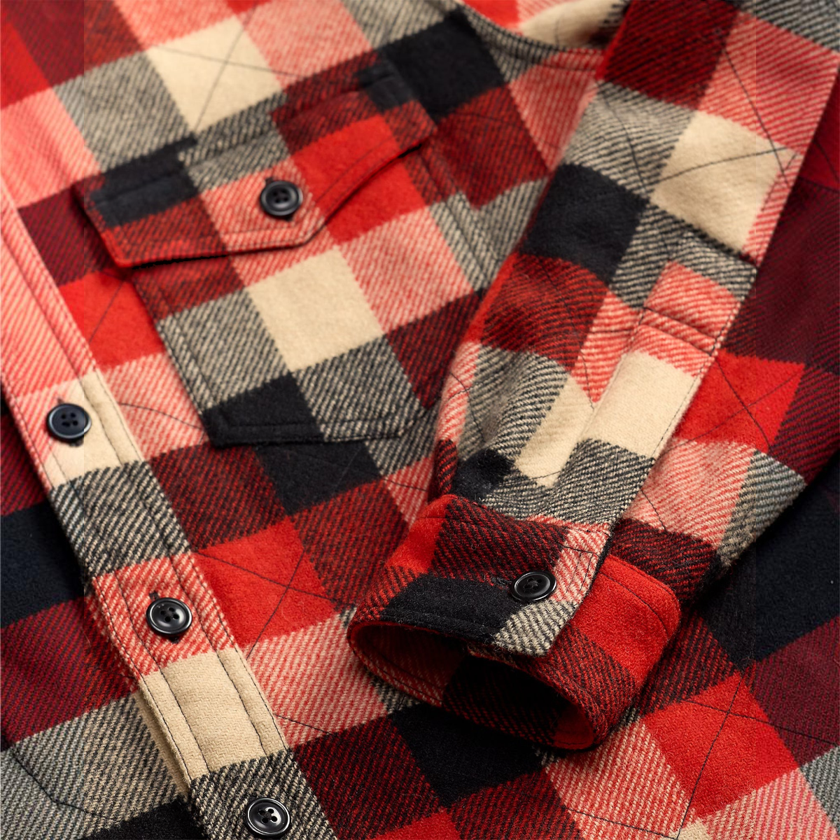 MILWORKS quilted plaid wool overshirt in red and black with buttoned chest pocket and barrel cuffs