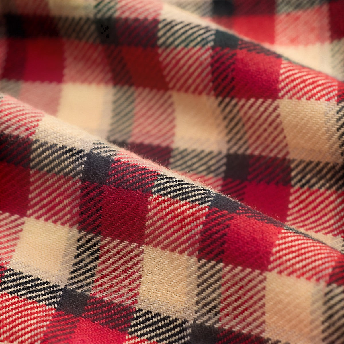 Close-up of MILWORKS red and cream plaid cotton twill fabric with a soft brushed finish and vintage-inspired pattern.