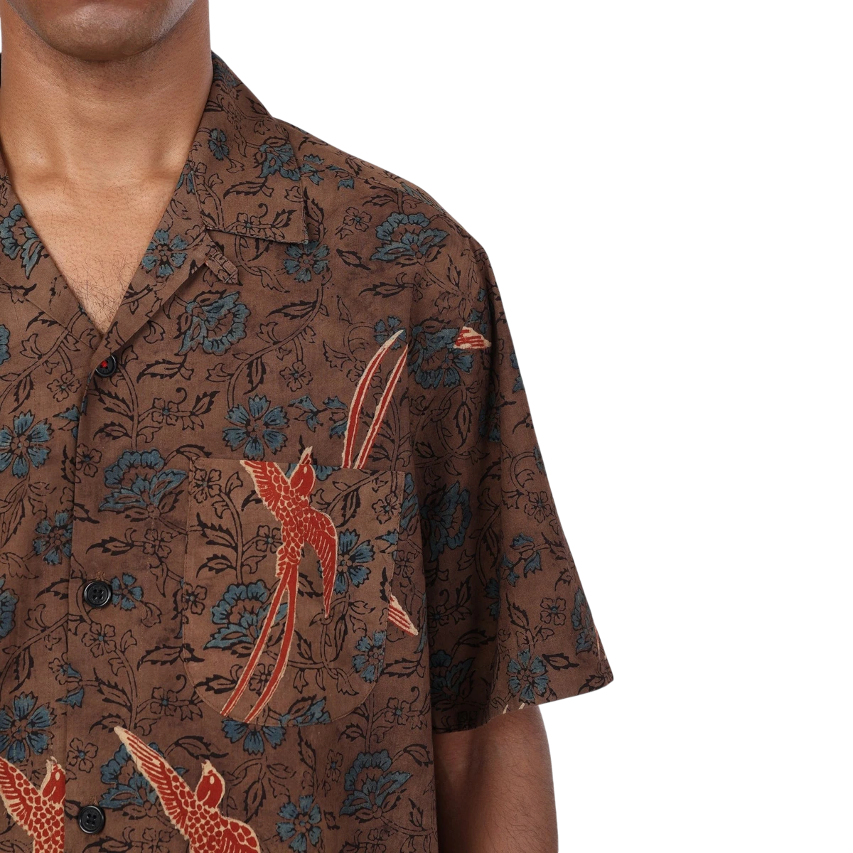MILWORKS Ronen short sleeve brown cotton shirt with blue floral and red bird Ajrakh print, camp collar, and corozo buttons.