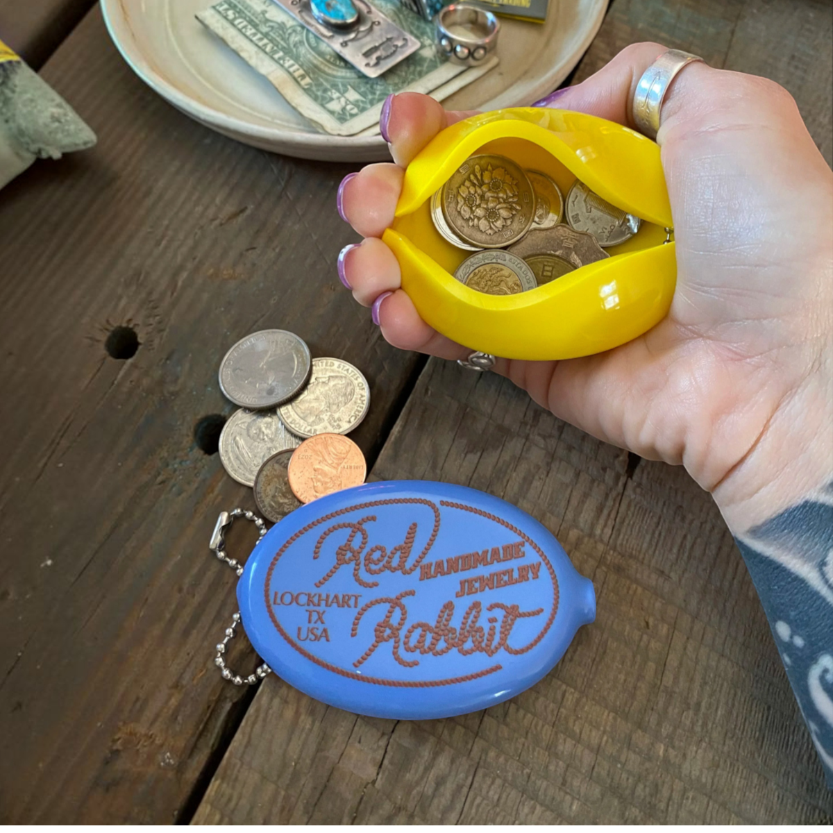 MILWORKS RR Coin Keeper squeeze pouches in steel blue and bright yellow with Red Rabbit logo and metal chain