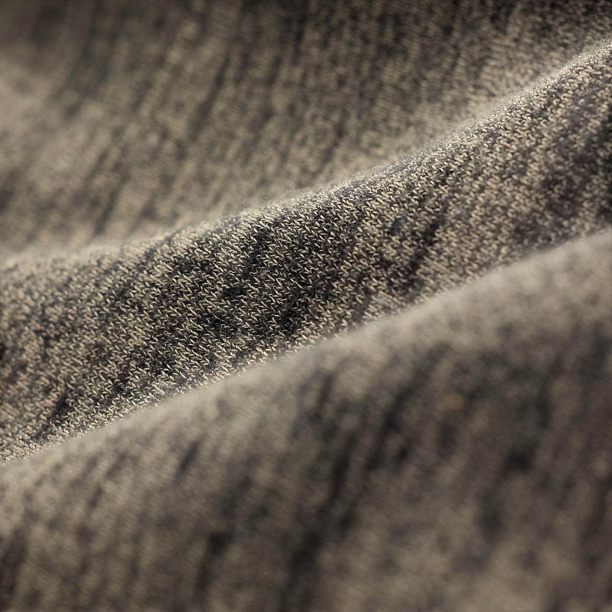 Close-up of MILWORKS RRL long sleeve knit cardigan in grey heather showing soft textured fabric detail