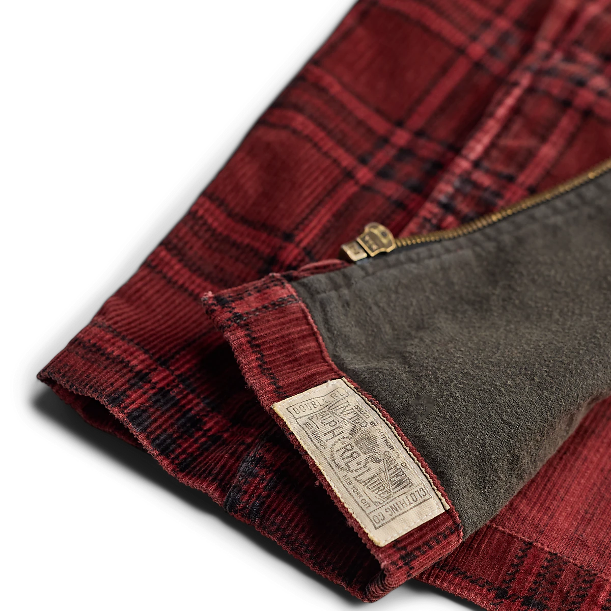 MILWORKS RRL red and black plaid corduroy overshirt featuring a soft fleece lining and branded interior label