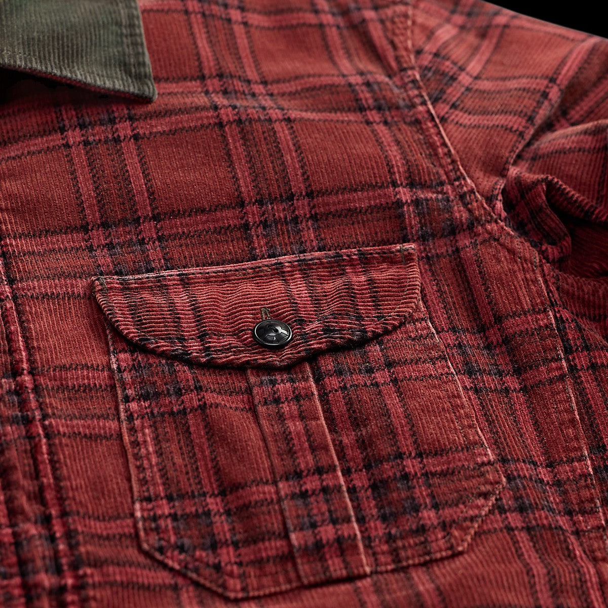 MILWORKS RRL red and black plaid corduroy overshirt with a buttoned chest pocket and dark green corduroy collar