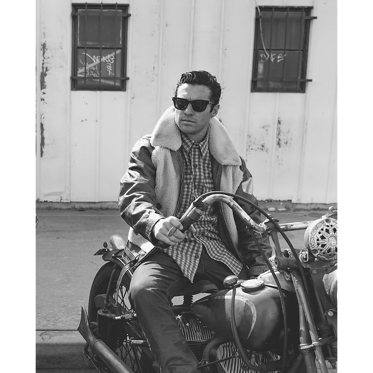 MILWORKS RRL vintage brown shearling moto jacket worn by a man on a motorcycle, featuring a thick fleece collar.