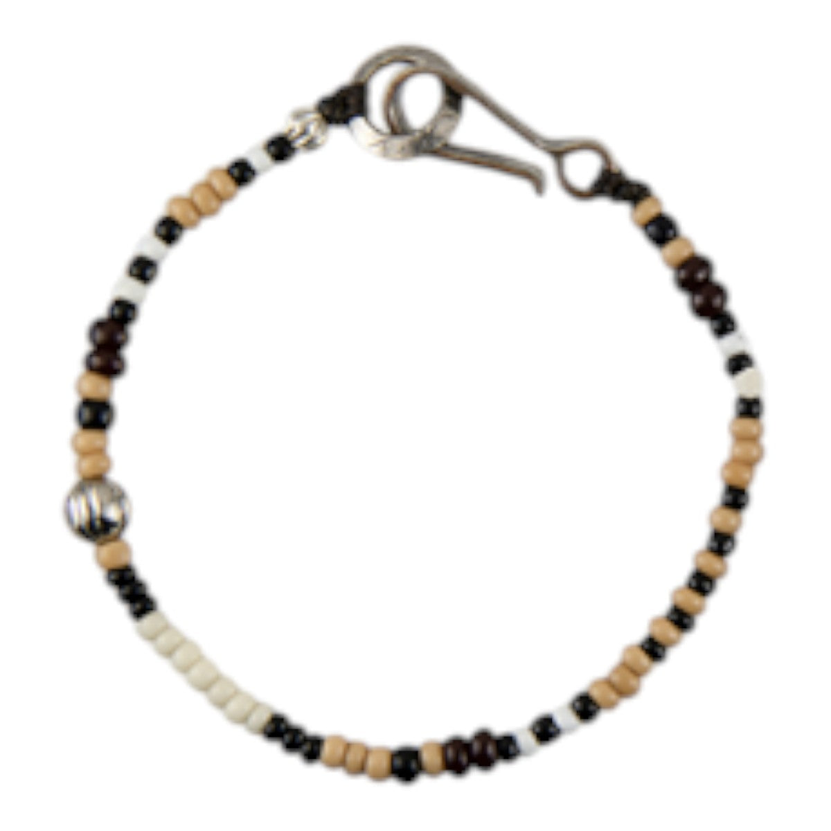 MILWORKS handmade shell bead bracelet in tan, black, and white with a vintage US nickel coin hook closure.