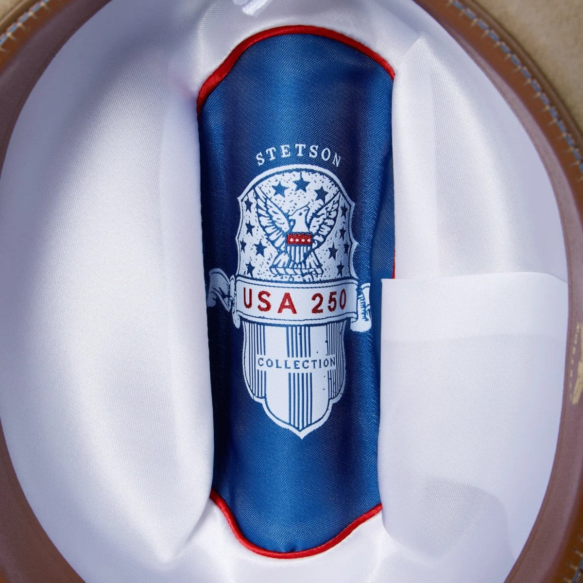 MILWORKS Stetson Open Road USA 250 Edition hat interior featuring a blue satin liner with patriotic eagle emblem.