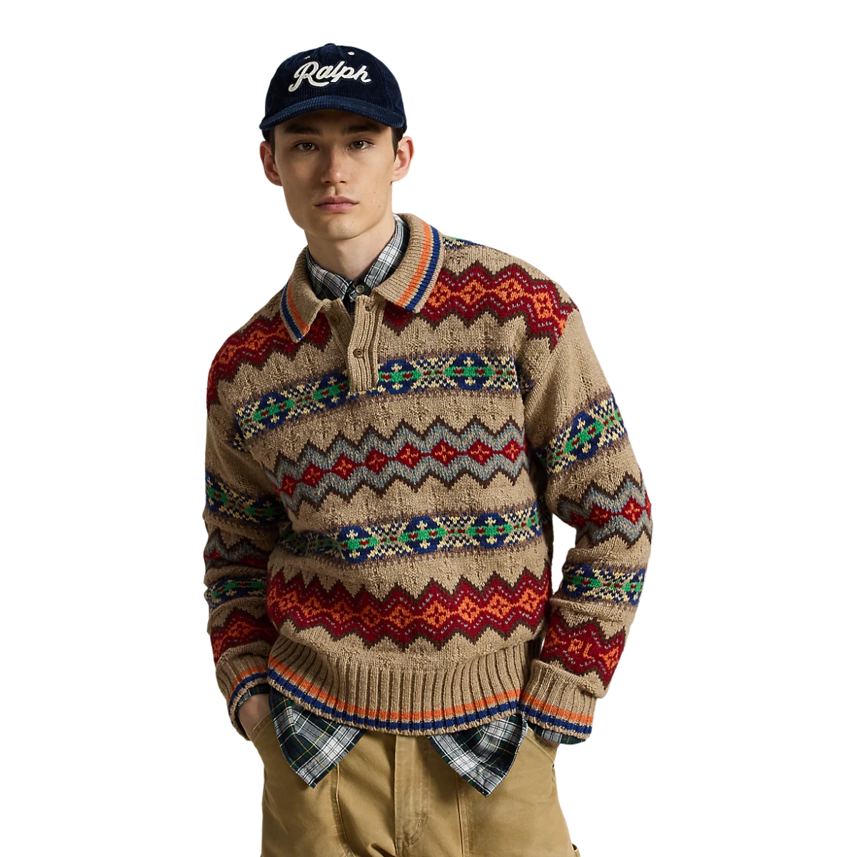MILWORKS model wearing a tan Polo Ralph Lauren Fair Isle sweater polo with a patterned knit and navy baseball cap