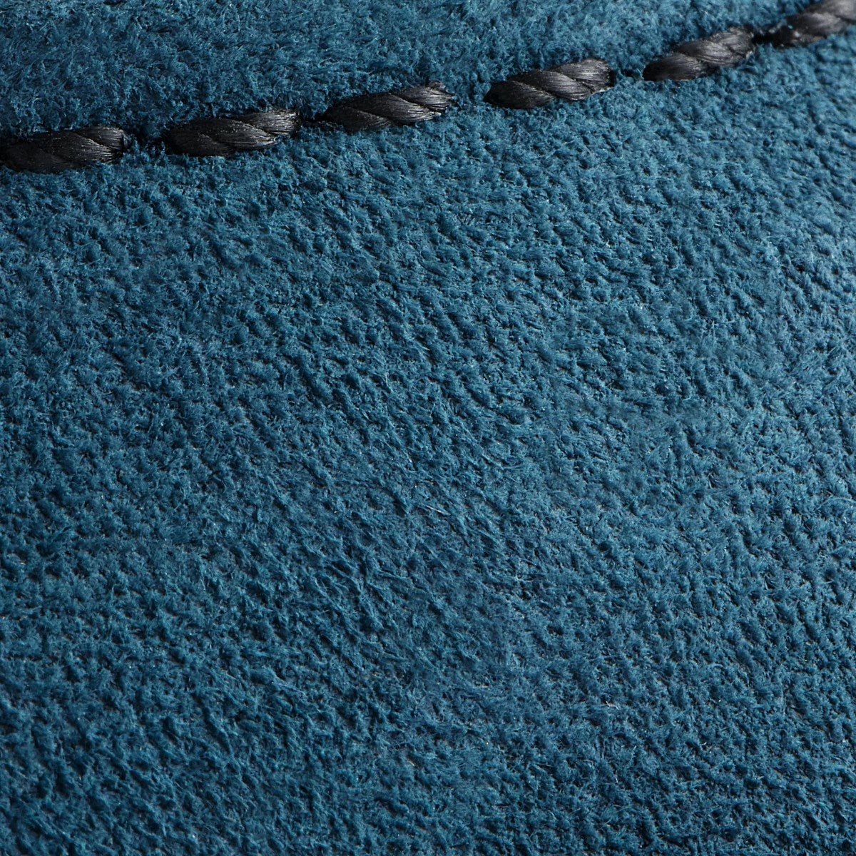MILWORKS close-up of blue Tidal Muleskinner roughout leather with black contrast stitching on a classic moc boot