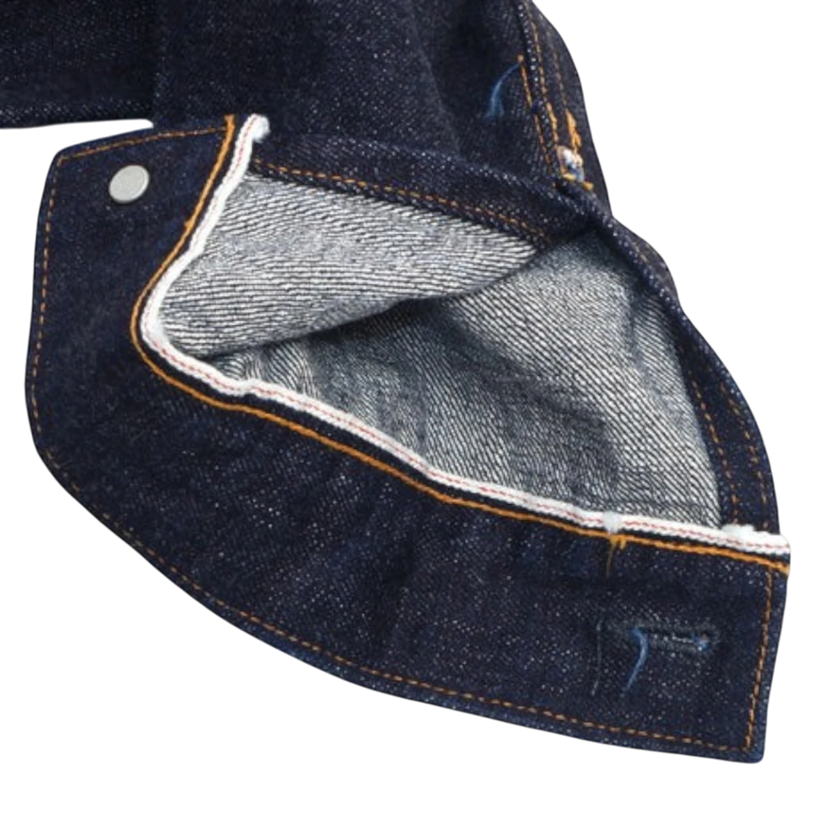 MILWORKS UES 17oz denim jacket cuff detail showing raw indigo cotton fabric and signature red selvedge ID.