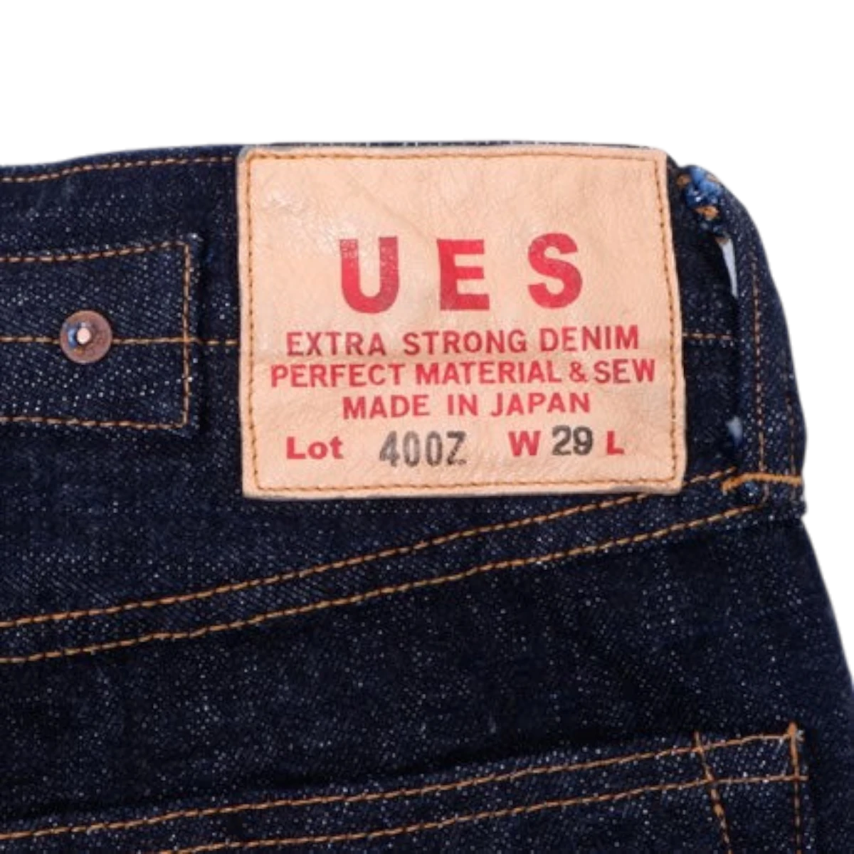MILWORKS UES 400Z 17oz raw selvedge denim jeans featuring a tan leather patch with red branding details