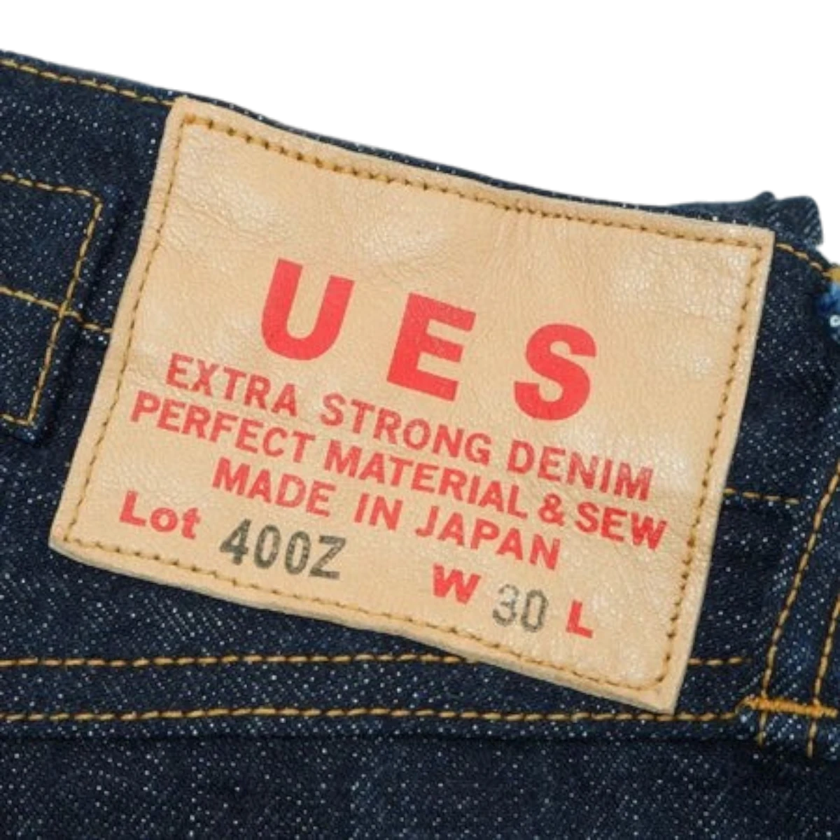 MILWORKS UES 400Z 17oz raw selvedge denim jeans featuring a tan leather patch with red branding details