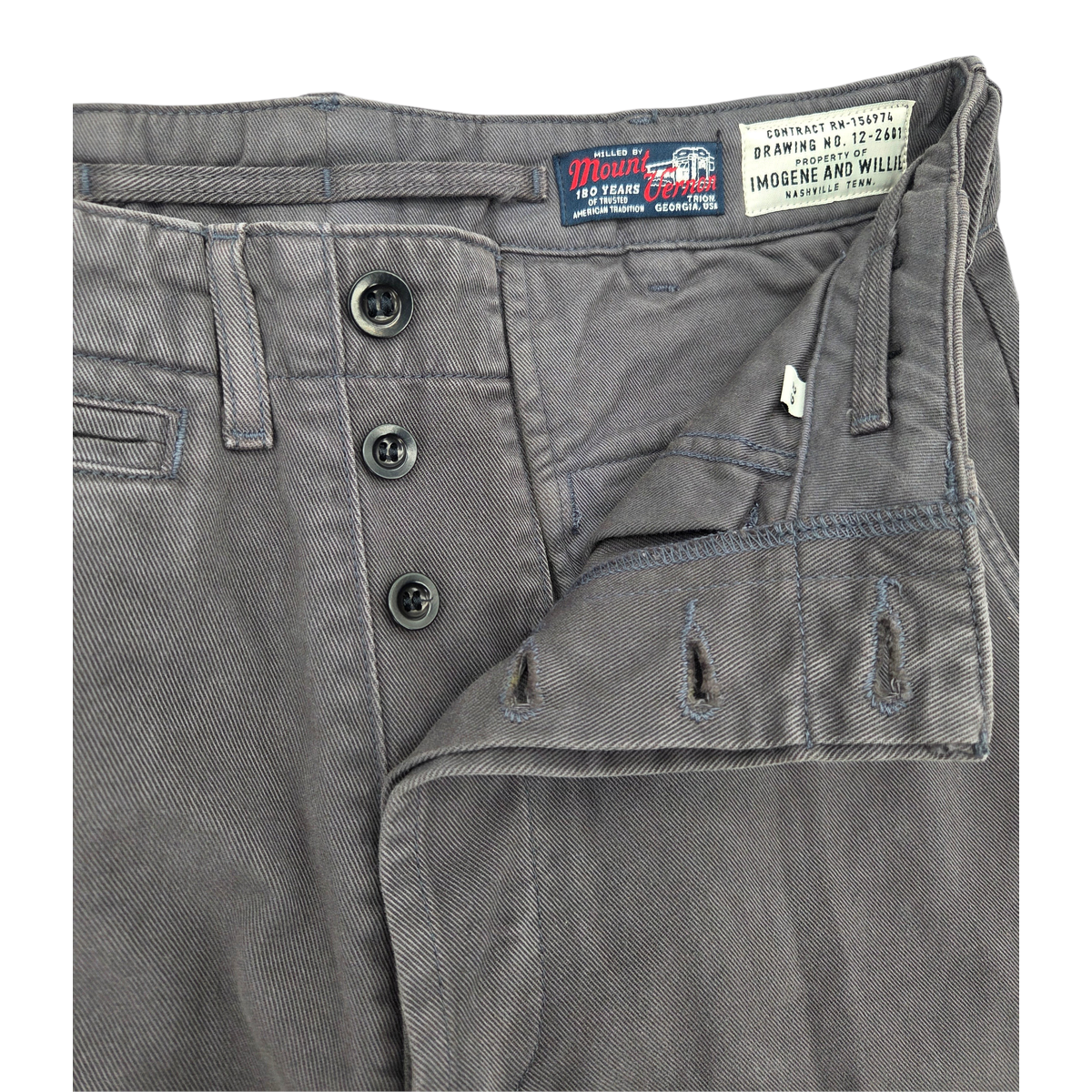 MILWORKS Wilkison trouser in washed charcoal featuring a button fly, vintage-inspired labels, and durable twill fabric.