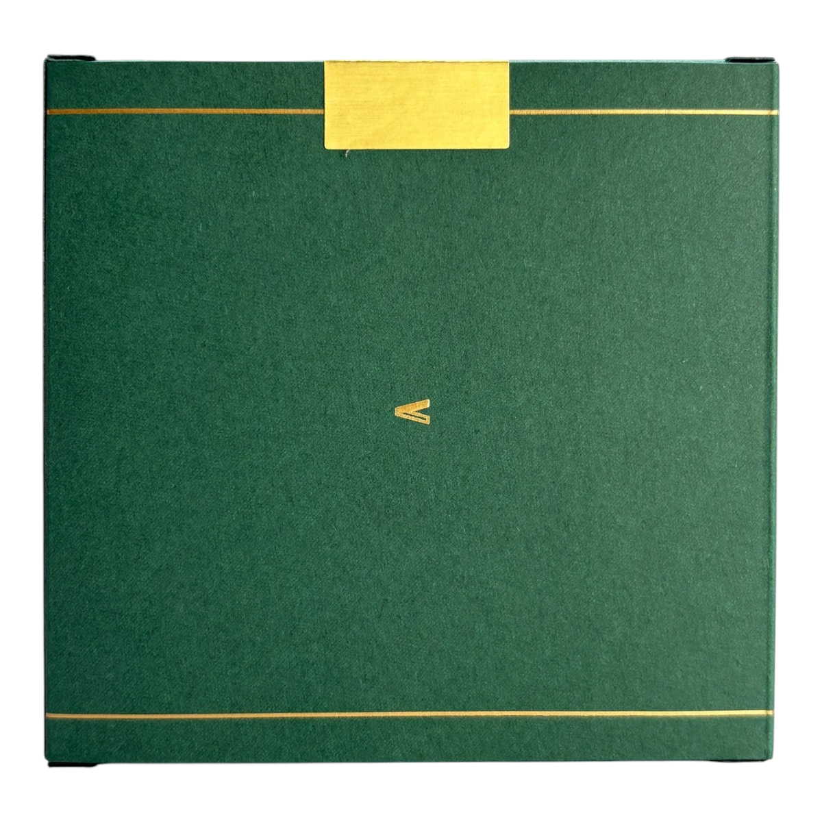 MILWORKS Youth perfume box in dark green with gold foil accents and a minimalist logo on a square matte finish.