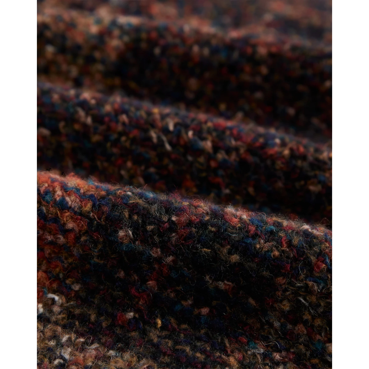MILWORKS Zender wool plaid shirt fabric detail showing textured multi-colored weave with deep red and blue tones
