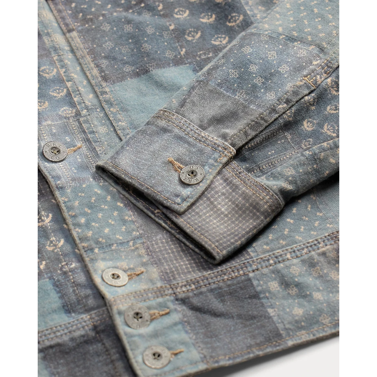 MILWORKSH navy multi patchwork-print cotton jersey work jacket with metal buttons and faded wash.